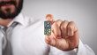 © andranik123 - Man showing HR word on wooden cubes.