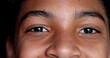 © Marco - Mixed race young boy closing eyes in meditation, child opening eyes smiling