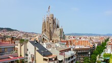 Arial View Drone Shooting Houses Civilian Apartments In Barcelona Cathedral Temple La Sagrada Familia In Town Church Historical Building In Spain Religious Catholic Architectural Masterpiece Of Gaudi