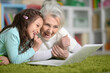 © aletia2011 - Cute little girl using laptop with grandmother