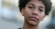 © Marco - Serious mixed race young boy looking at camera. Black ethnic kid portrait
