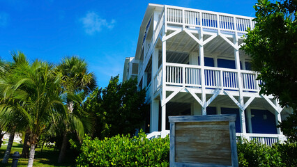 Wall Mural - Beach on Ocean Cay Bahamas Island with a colorful houses and turquoise water