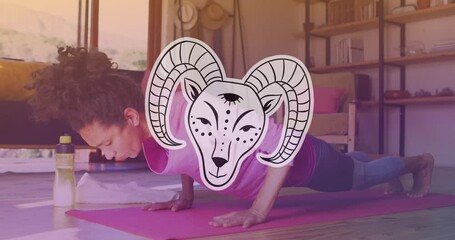 Sticker - Animation of aries star sign over caucasian woman exercising at home