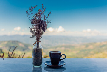 Coffee cup on the table with beautiful view in the morning.