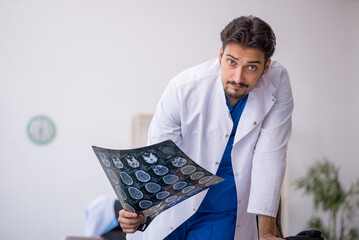 Young male doctor radiologist working in the clinic