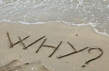 Word WHY In Capital Letters On The Sand Of The Beach By Trhe Sea