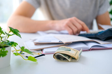 Wall Mural - the man sums up the calculations on the calculator on the table. payment of utility services. the co