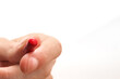 Holding a red medicine capsule with a white background and copy space