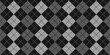 Seamless diamond argyle wool knit fabric background texture. Tileable black and white monochrome greyscale knitted sweater, scarf or cozy winter socks pattern. Woolen crochet textile 3D rendering..