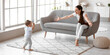 © Pixel-Shot - Mother teaching her cute baby to walk at home