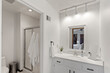 © samiam2007 - Modern Efficiency: Short-Term Rental with White Cabinets, Wood Floors, and Open Floor Plan
