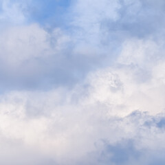 Wall Mural - Cloudy sky background with pale pink clouds at sunset