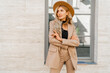 © Svetlana Sokolova - Fashion outdoor photo of stylish blond woman with perfect wavy hairs in beige hat and casual suit.