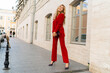 © Svetlana Sokolova - Fashion photo of beautiful blond woman   in stylish  luxury velvet suit posing outdoor.  Full lenght.