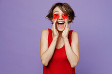 Young Promoter Woman 20s She Wear Red Tank Shirt Eyeglasses Look Camera Scream Hot News About Sales Discount With Hands Near Mouth Isolated On Plain Purple Backround Studio. People Lifestyle Concept.