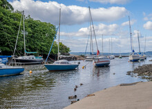 Sailing Boats And Leisure Boats Moored Up At The Mouth Of The Almond River At Low Tide