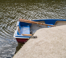 Small Rowboat Tied Up To The Quayside