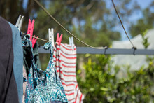 Washing Pegged On To A Clothes Line To Dry In The Sun