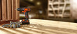 © magdal3na - Drill on table and workshop interior. Free space for your products.