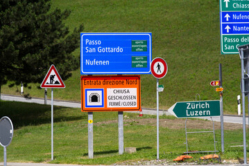 Traffic signs at mountain village Airolo, Canton Ticino, on a sunny summer day. Photo taken June 25th, 2022, Airolo, Switzerland.