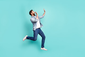 Sticker - Full length portrait of impressed terrified person look empty space jump isolated on turquoise color background