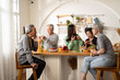© Yingyaipumi - Group of Asian elder people friends making vegetables salad and fruit juice with her daughter in kitchen at home.concept of Group asia senior people Healthy eating,colorful fruits and vegetables.