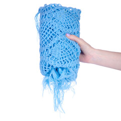 Sticker - A blue scarf cape is crocheted handmade in hand on white background isolation