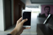© adelukmanulhakim - mobile phone concept holding to take picture, black screen