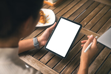 Poster - close-up women holding digital tablet white screen and stylus pe