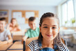 © Iryna - Children in the classroom at the lesson. Portrait of face pupil girl of elementary school.