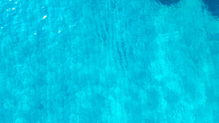 Poster - sea from a drone. Blue sea surface from above. Sea surface aerial view. The color of the water and beautifully bright. Aerial view of a crystal clear sea water texture