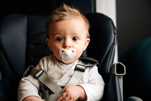 Front View Of A Baby In Its Seat With Seat Belt