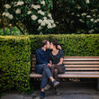 © Irina Efremova/Stocksy - Couple kissing on park bench