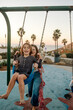 © Erin Brant/Stocksy - Mother and daughter at ocean playground