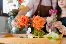 Family Making Arrangement With Freshly Cut Flowers