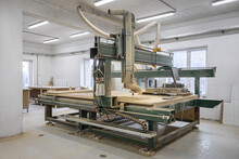 Industrial Machine Creating A Wooden Element For Kraft Furniture