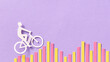 © Yaroslav Danylchenko/Stocksy - Cyclist riding on diagram