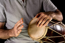 Man Playing Hand Drum With His Hands