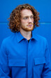 © Bisual Studio/Stocksy - Ginger man in blue clothes