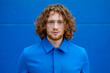© Bisual Studio/Stocksy - Ginger man in blue clothes