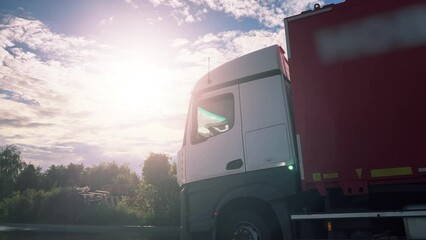 Wall Mural - Semi-trailer truck is driving to the logistics park  for unloading and loading at the warehouse ramp. Low angle view. Side view