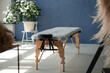 © Milles Studio/Stocksy - Massage table in sunlit room