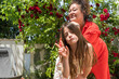© Eloisa Ramos/Stocksy - Funny woman and cute girl posing in garden