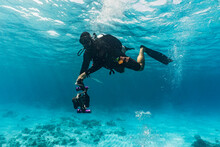Underwater Photographer Diving At The Tubbataha Reef