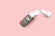 © Yaroslav Danylchenko/Stocksy - Payment terminal with long empty receipts