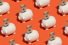 Piggy Banks With A Hundred Dollar Cash Bill. Savings Concept.