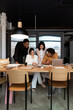 © Bisual Studio/Stocksy - Diverse employees working in office