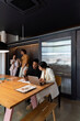 © Bisual Studio/Stocksy - Diverse employees working and taking break in office