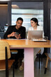 © Bisual Studio/Stocksy - Diverse businesspeople sharing and discussing data