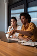 © Bisual Studio/Stocksy - Multiracial colleagues analyzing data on laptop